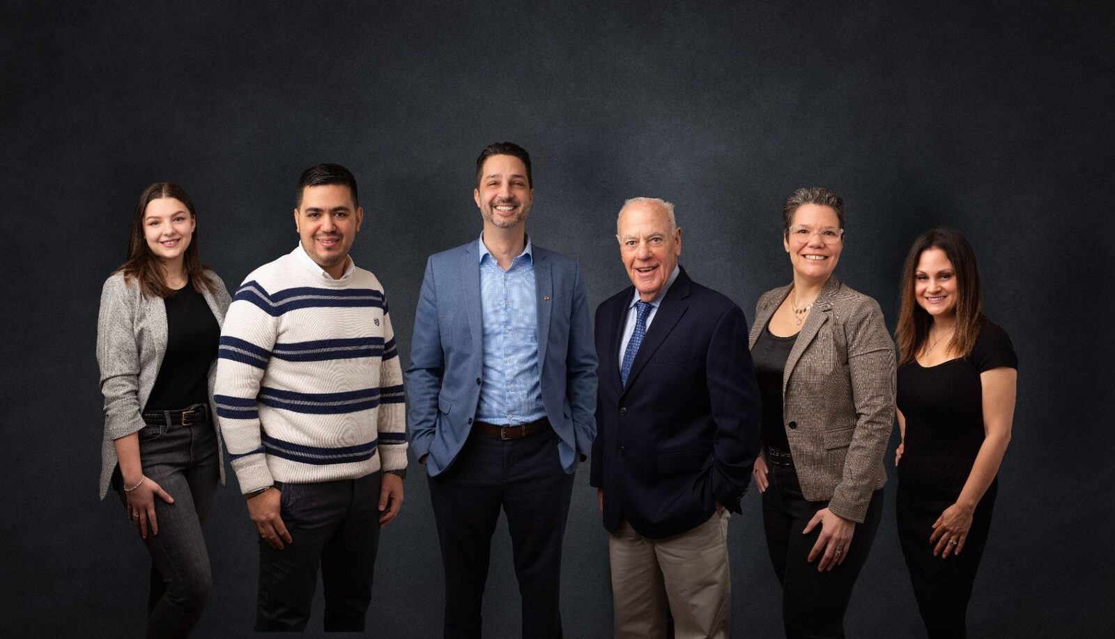 Tomassi Law team gathered together for a group portrait